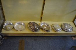 Collection of entree dishes and covers and other service dishes.