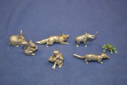Miniature cast metal animals.