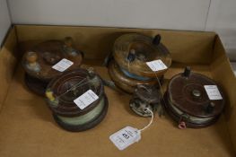 Five various early fishing reels.