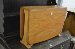 A good Ercol light elm small drop-leaf occasional table.