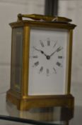 A brass carriage clock.
