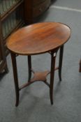 A mahogany oval occasional table.