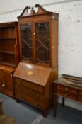 An Edwardian inlaid mahogany bureau bookcase.