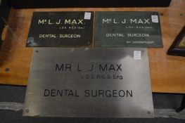 Three dental surgeon plaques.