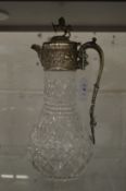 A good cut glass claret jug with plated mounts.