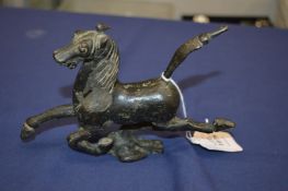 Cast metal model of a prancing horse.