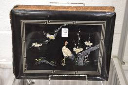 A Chinese black lacquer postcard album containing numerous colour postcards of China and its