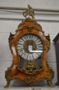 A decorative French mantel clock.