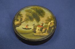 A small circular lacquer papier mache snuff box, the cover decorated with a gondolier.
