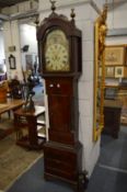 A 19th century mahogany longcase clock, the painted arched dial with moon phase movement.
