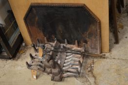 Cast iron fire back, fire grate and tongs.