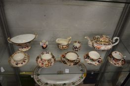 A Derby Imari decorated twin handled oval shaped pedestal bowl together with similar porcelain.