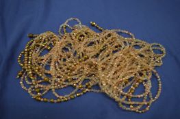 A very long crystal necklace.