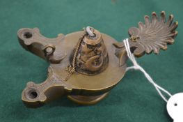 A bronze double oil lamp with shell handle.