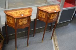 A pair of French style marquetry inlaid three drawer bedside chests.