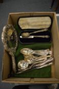 Silver backed dressing table mirror, silver spoon and fork and plated flatware.