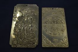 Two Chinese white metal ingots.