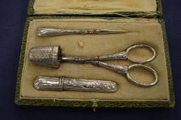 A cased silver manicure set.