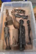 Various African carved wood figures and other items.
