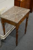A small mahogany and marble top side table.