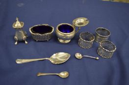 Silver napkin rings and other items.