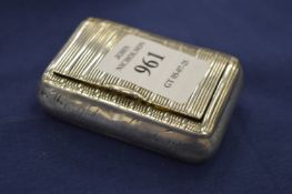 A silver snuff box.