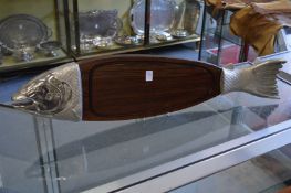 A plated and hard wood fish shaped platter.