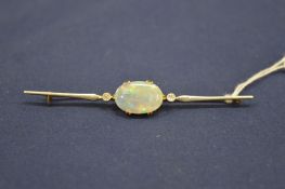 A good 15ct gold, platinum, opal and diamond bar brooch.