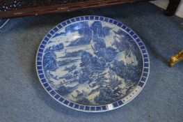 A large Chinese blue and white charger (cracked).