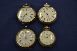 Four various pocket watches.