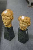 A pair of antique style busts on marble bases.
