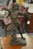 Neal Godfrey, standing male nude wrestling with a snake, bronze resin.