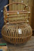 A bamboo magazine rack and wicker stool.