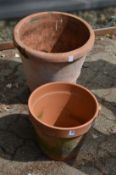 Two large terracotta plant pots.