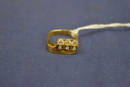 A 18ct gold and diamond ring of stylish design.
