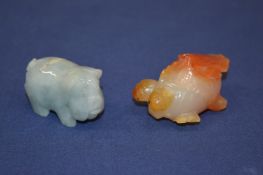 Two carved hard stone animals.