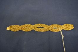An 18ct gold interwoven mesh bracelet, housed in a Bulgari box.