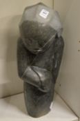 S Mubaya, a carved stone female figure.