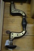 An early brass and ebony 'altimatum' carpenters brace.