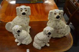 Two pairs of Staffordshire spaniels.