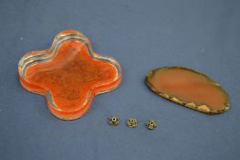 Two pieces of amber style material.