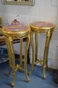 A pair of tall gilt wood and marble inset jardiniere stands.