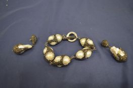 Decorative diamante and pearl bracelet and earrings.