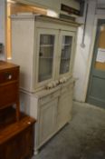 A painted dresser with glazed top, under-tier and base with two drawers and two cupboard doors.