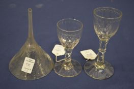 Two Georgian cut glass wine glasses, one with a foot rim chip together with a Georgian wine funnel.