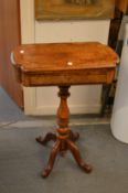 A Victorian burr walnut and inlaid combination games/work table on pedestal support.