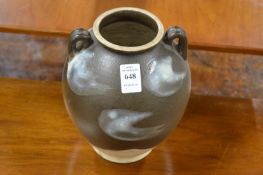 Chinese brown glazed pottery twin handled vase.