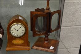 An Edwardian inlaid mantel clock, a revolving picture frame.