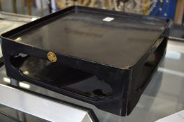 A Japanese black lacquer two tier stand.