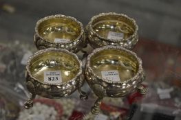 A set of four silver salts with hoof feet.